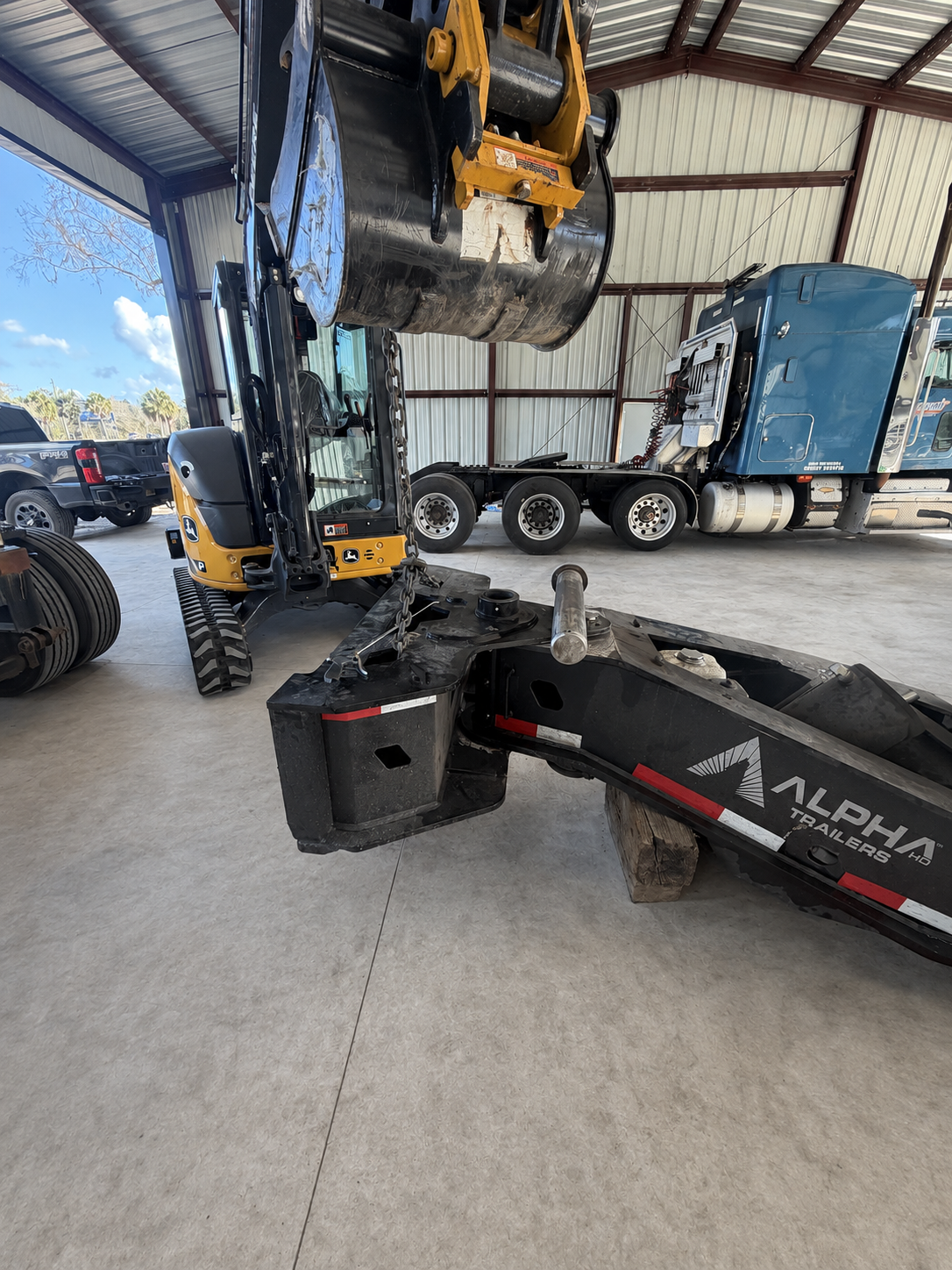 Heavy-haul trailer stinger pin being removed with shop equipment at SEG