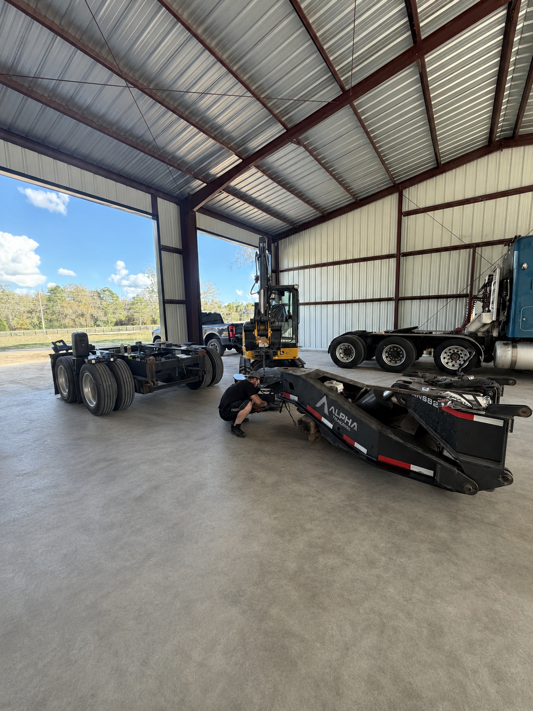 SEG technician working on a heavy-haul trailer stinger in Waldo Florida