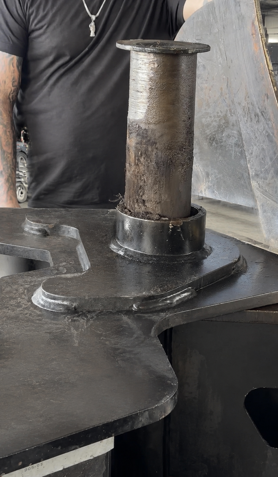 Close-up showing heavy wear on the removed heavy-haul trailer stinger pin